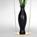 <p><strong><a href=andrea-branzi.html class=link-lightbox>Andrea Branzi</a></strong><br />Uomini e Fiori</p><p><strong>Eugubino</strong><br />Flower vase in natural  black ceramic “bucchero“ with metal <br />Base and frame silver  plated.<br />34 x h. 44 cm.</p><p>Limited edition of 20  signed and numbered pieces.</p> 